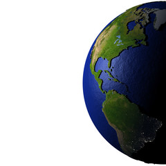 Americas on model of Earth with embossed land