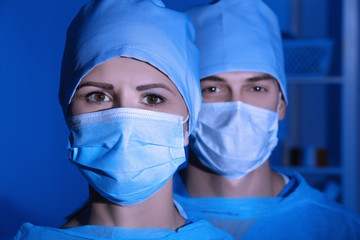 Portrait of young surgeon with colleague in modern clinic