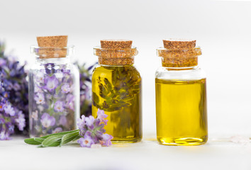 Wellness treatments with lavender flowers on wooden table.