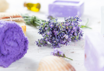 Obraz na płótnie Canvas Wellness treatments with lavender flowers on wooden table.