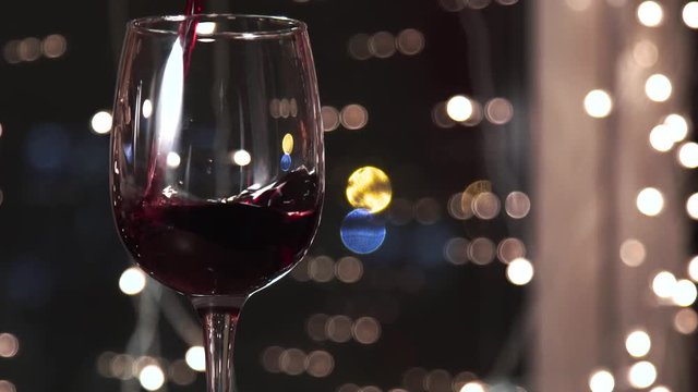 Red wine poured into glass shooting with high speed camera, phantom flex.