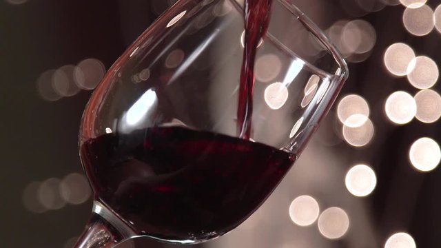 Red wine poured into glass shooting with high speed camera, phantom flex.