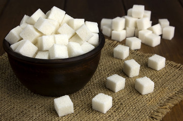 sugar cubes in a pot with a wooden spoon
