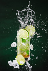 fresh mojito drink with liquid splash and crushed ice in freeze motion.