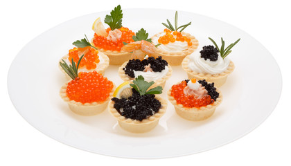 Set tartlets on a white plate.