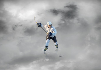 Fototapeta na wymiar Ice hockey player on the ice, outdoors