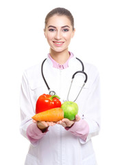 Young female nutritionist on white background