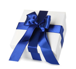 Beautiful gift box with blue ribbon on white background
