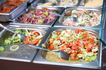 Steel self service trays filled with delicious food
