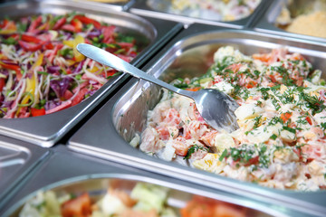 Steel self service trays filled with delicious food