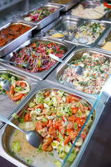 Steel self service trays filled with delicious food