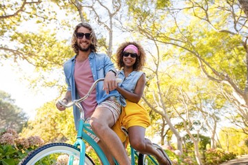 Couple cycling in the park