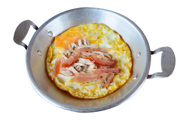 Fried egg in pan with white pork sausage