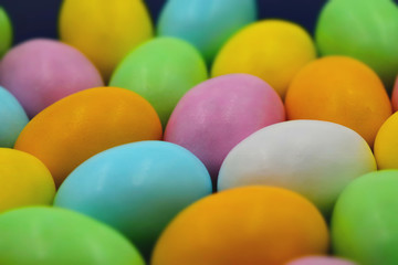 Close up of colorful Easter eggs. Suitable to be used like a background. Tilt-shift effect applied.