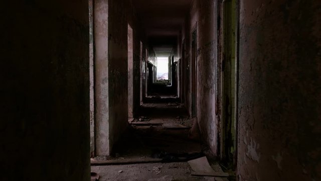 Corridor in the abandoned house. Smooth and slow steady cam shot