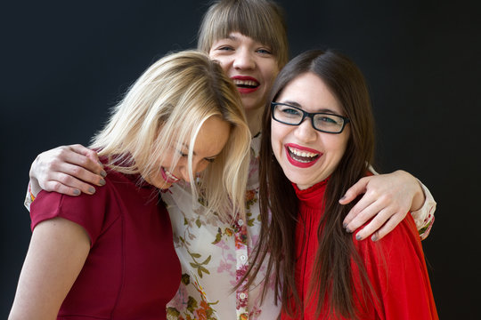 Three laughing female friends