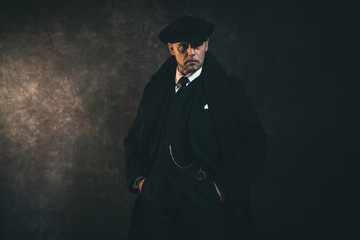 Retro 1920s english gangster. Peaky blinders style.