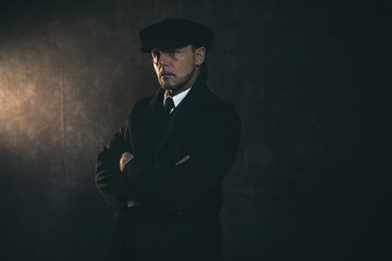 Retro 1920s english gangster. Peaky blinders style.