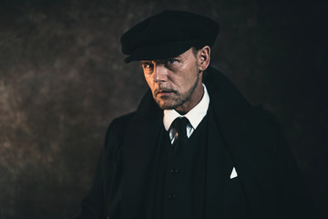 Retro 1920s english gangster. Peaky blinders style.