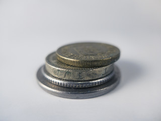 four coin on a white bakground