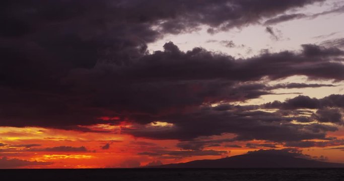 Fiery Dusk After Sunset behind Ocean Island Horizon in Maui Hawaii