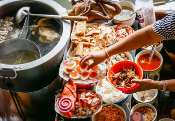 Colored thai food in floating market, food seller in Thailand, typical thai food background