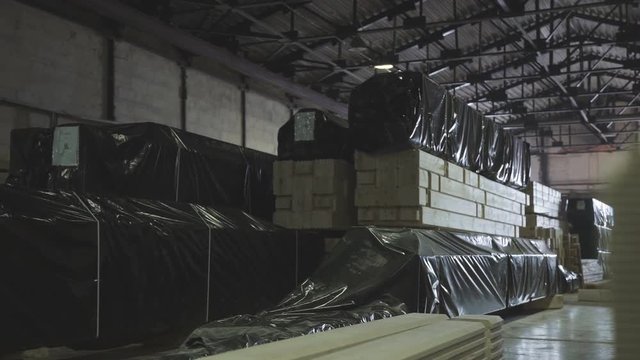 LVL glued Lumbe. Wood Factory general plan: the production of laminated veneer lumber. Neatly glued beam is in the manufacturing workshop.