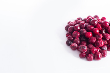 .Frozen cherries on a white background