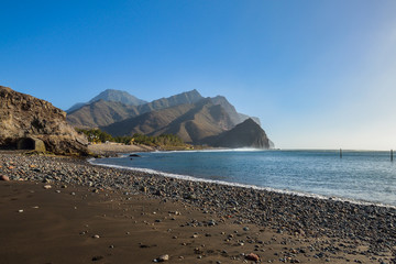 Fototapeta na wymiar Rocky beach on the atlantic coast in the west part of Gran Canaria island 