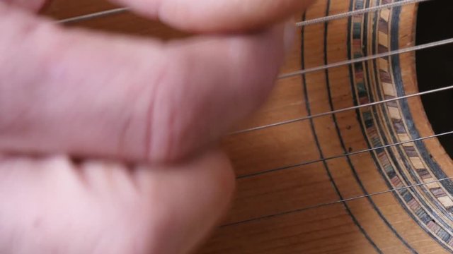 Close-up of the guitarist's fingers