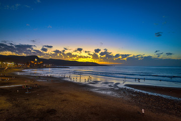 Beautiful sunset on the Las Canteras beach along the city of Las Palmas de Gran Canaria, Spain
