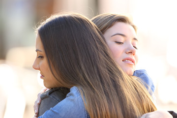 Hypocritical angry friends embracing