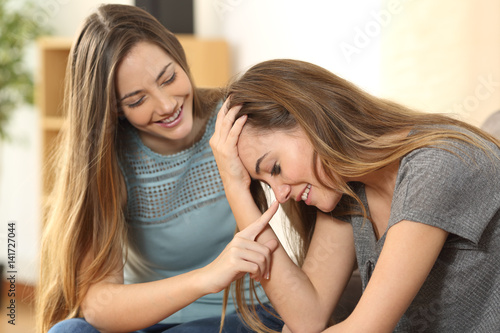 Girl Trying To Comfort To Her Sad Friend Stock Photo And Royalty