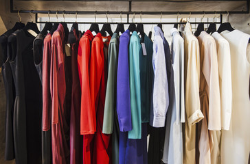 Colorful clorhes on racks in a fashion boutique