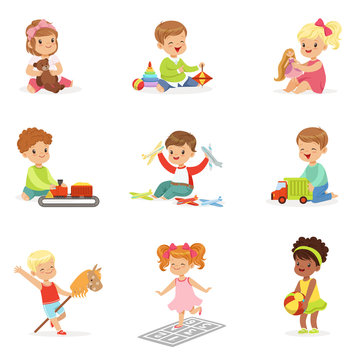 Cute Children Playing With Different Toys And Games Having Fun On Their Own Enjoying Childhood.