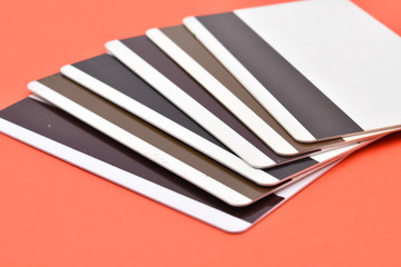Magnetic cards on red background.