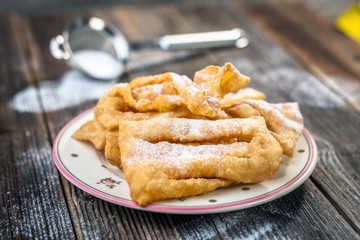Flancat- crisp deep fried pastry dusted with powdered sugar