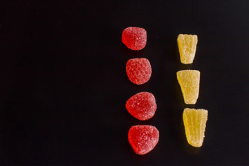 .Bright tasty marmalade on a white background