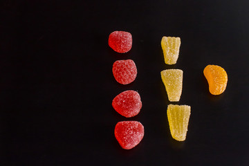 .Bright tasty marmalade on a white background