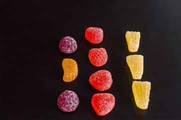 .Bright tasty marmalade on a white background