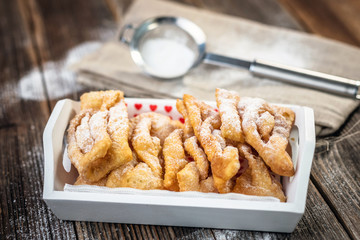 Flancat- crisp deep fried pastry dusted with powdered sugar