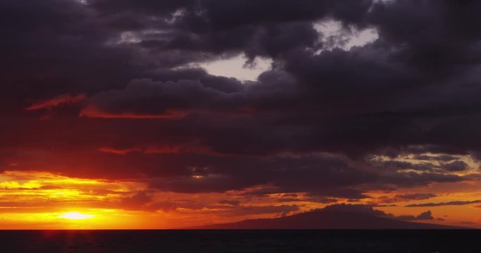 Bright Warm Sun Setting Behind Ocean at Big Beach in Maui Hawaii