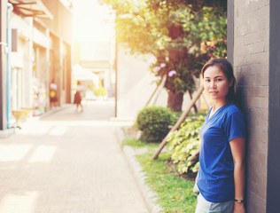 Woman smiling with perfect smile  in a park and looking at camera