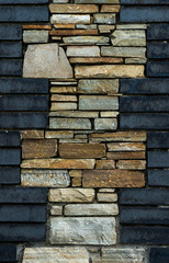 Contrasting Dark and light coloured stone brick wall design
