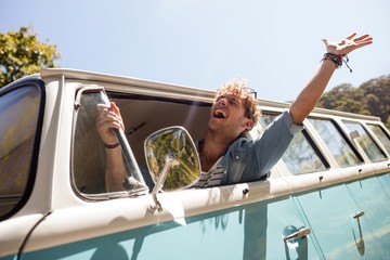 Man looking out of camper van window