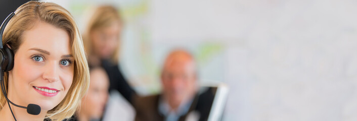 Portrait of smiling secretary in office