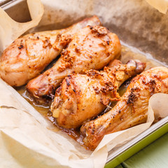 Prepared chicken on cooking paper