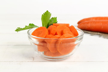 Fresh carrot with celery leaf on white background