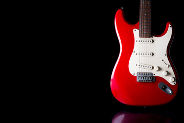 Electric guitar on black background. Free space for text - obrazy, fototapety, plakaty