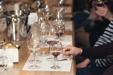 people consider the color of the wine and try how it smells in different glasses